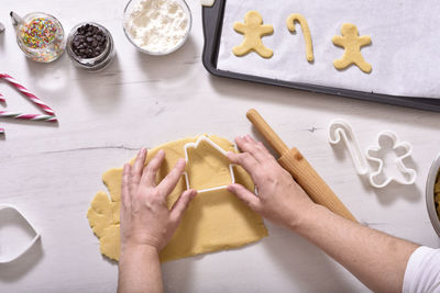 High angle view of woman preparing food on table