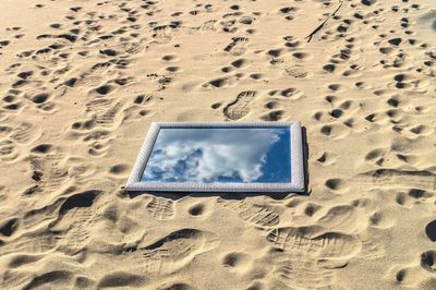 Close-up of footprints on sand