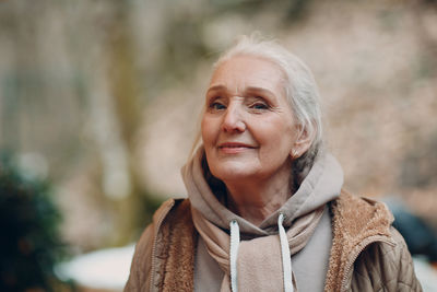 Portrait of a smiling woman in snow