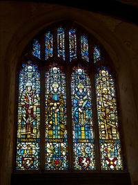 Low angle view of glass window in building