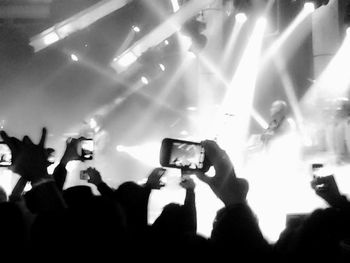 Silhouette of people at concert