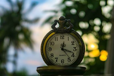 Close-up of pocket watch on table