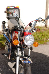 Close-up of bicycle parked on road