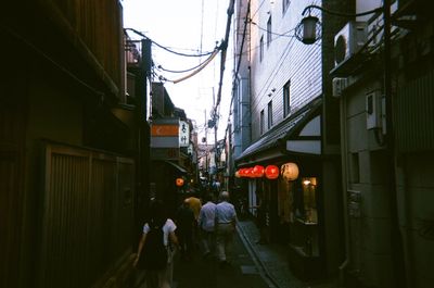 People walking on street in city