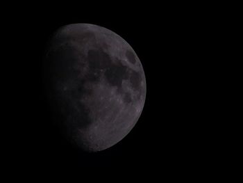 Low angle view of moon against sky at night