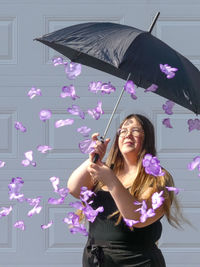 Woman standing on pink flowers