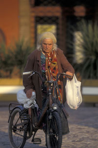 Portrait of man riding bicycle