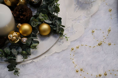 Golden christmas balls. festive ornament decoration. candle, conifer cone