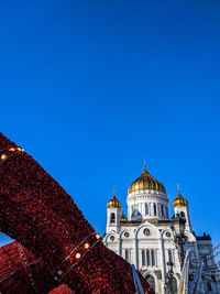 Low angle view of building against blue sky