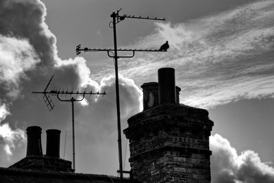 Low angle view of building against cloudy sky