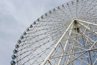 Low angle view of ferris wheel against sky