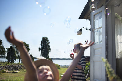 Children playing with soapbubbles