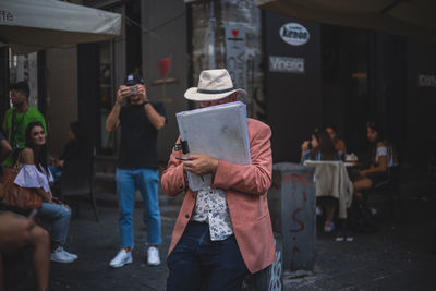 People standing on street in city