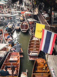 High angle view of boats moored in city