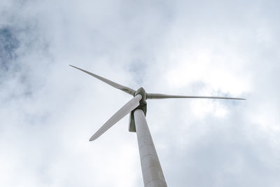 Low angle view of windmill against sky