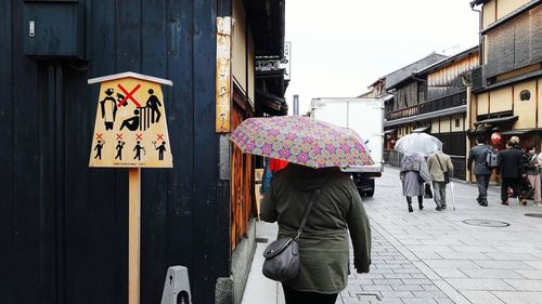 Full length of man with umbrella