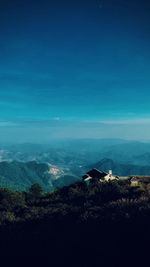 High angle view of landscape against blue sky