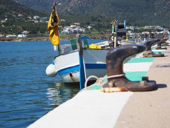 Boat moored on sea shore