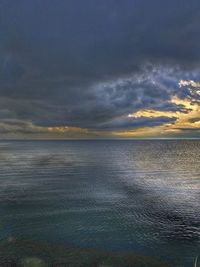 Scenic view of calm sea at sunset