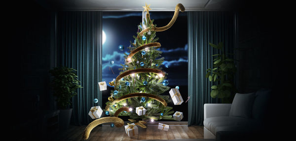 Gift boxes levitating by illuminated christmas tree at home