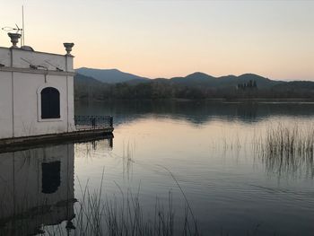 Scenic view of lake against sky during sunset