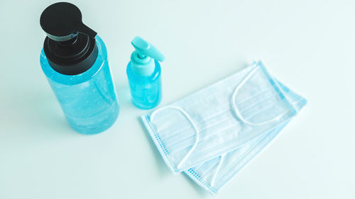 High angle view of bottles against white background