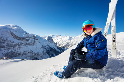 Man skiing on snowcapped mountain