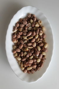 High angle view of coffee beans in plate