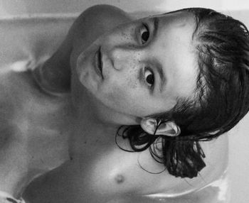 Portrait of child in bath