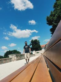 Man on road against sky