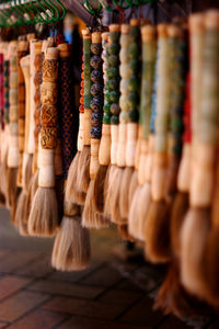 Close-up of multi colored brushes in market