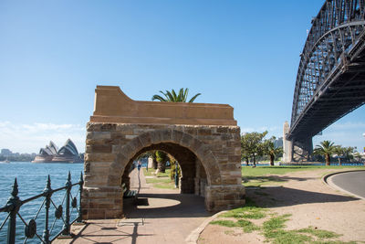 Arch bridge against blue sky