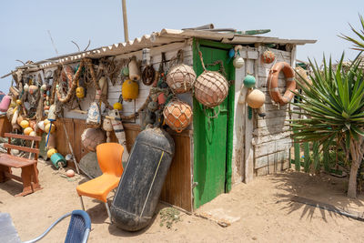 Clothes drying on beach against sky