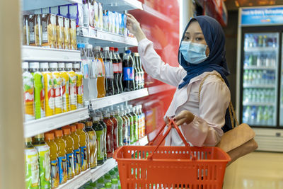 Portrait of woman standing in store