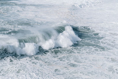 Waves splashing on shore