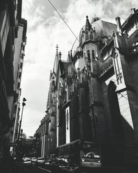 Low angle view of buildings in city against sky