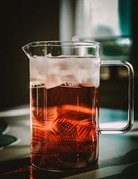 Close-up of drink in jug on table