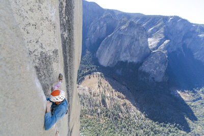 Rock climber crack climbing on the nose, el capitan in yosemite