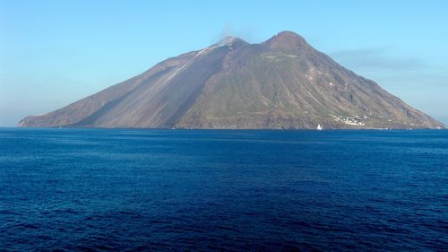 Scenic view of sea against blue sky