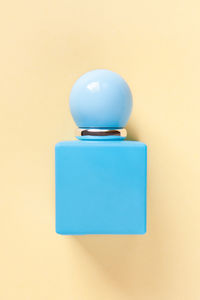 Close-up of blue toy over white background