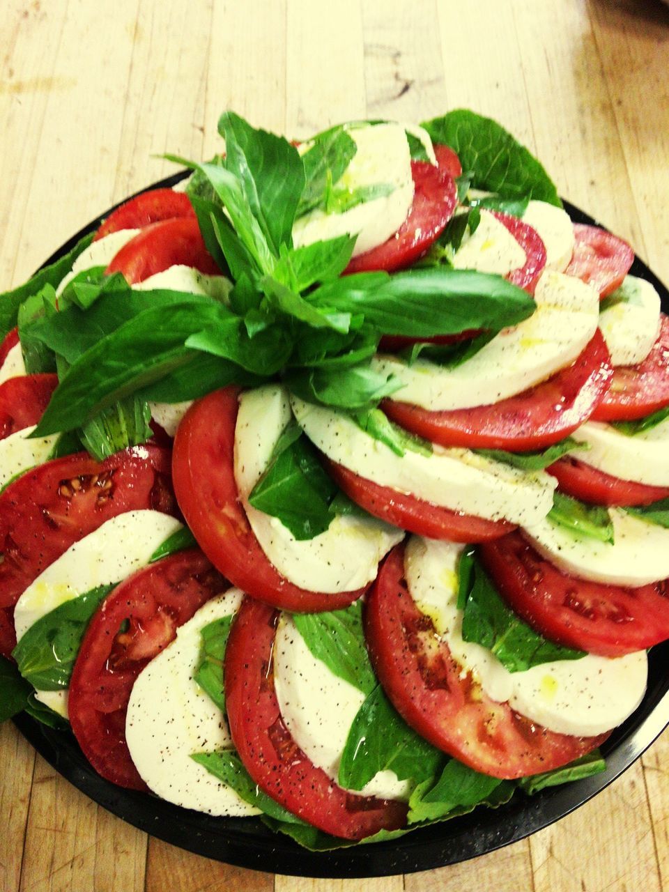 food, food and drink, vegetable, tomato, freshness, healthy eating, table, no people, indoors, slice, leaf, red, close-up, basil, ready-to-eat, day