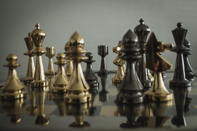 Close-up of chess pieces on table