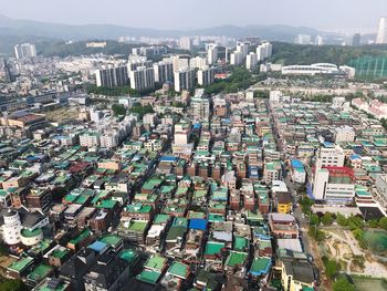 High angle view of buildings against sky in city