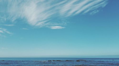 Scenic view of sea against blue sky