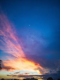 Low angle view of dramatic sky at sunset