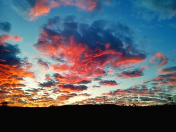 Low angle view of dramatic sky during sunset