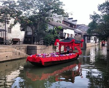 Boats moored in river