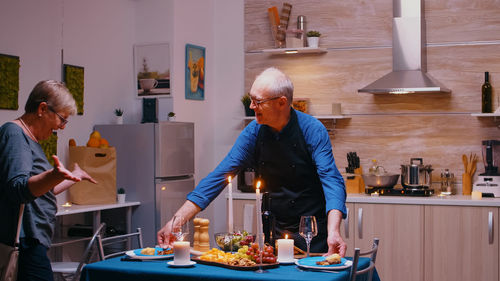 Rear view of man working at home