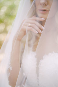 Midsection of woman with umbrella