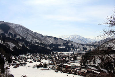 High angle view of buildings and mountains against sky